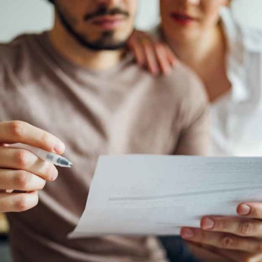 Couple checking a bill or financial document
