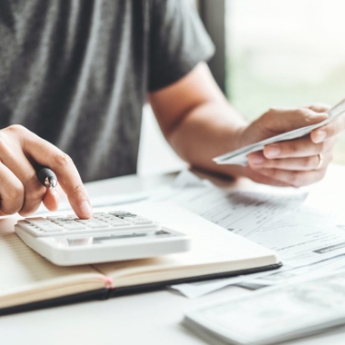 A man using a calculator