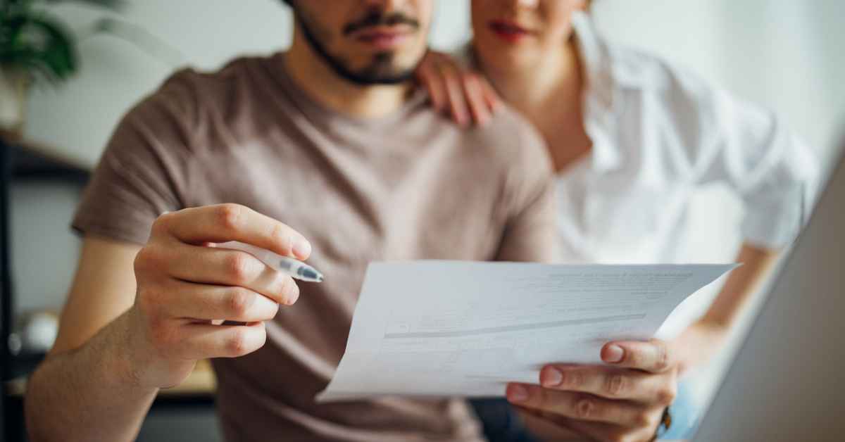 Couple checking a bill or financial document