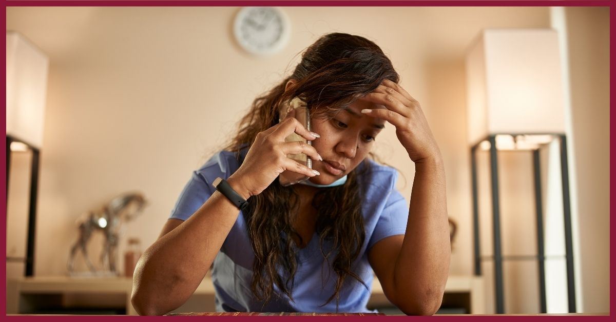 stressed nurse on phone