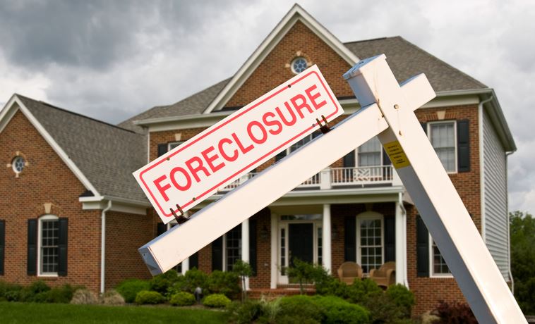 Foreclosure Sign in Front of House